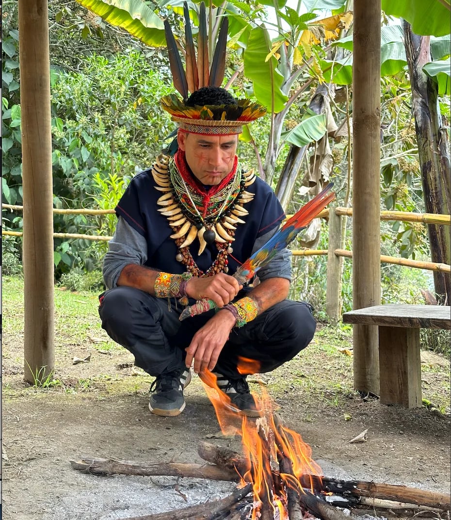 Taita Diego Marmolejo praying by the sacred fire at Camino al Sol