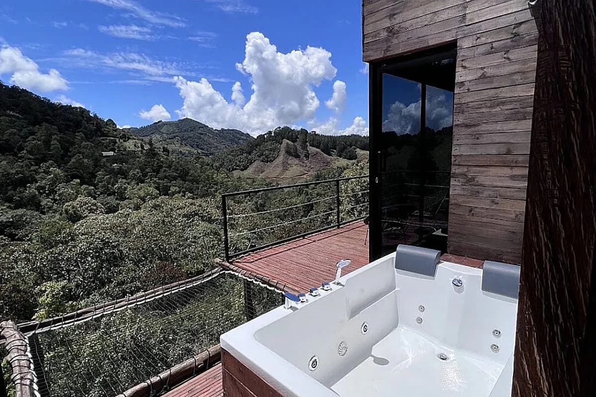 Warm wooden cabin interior with a double bed at Yaogará